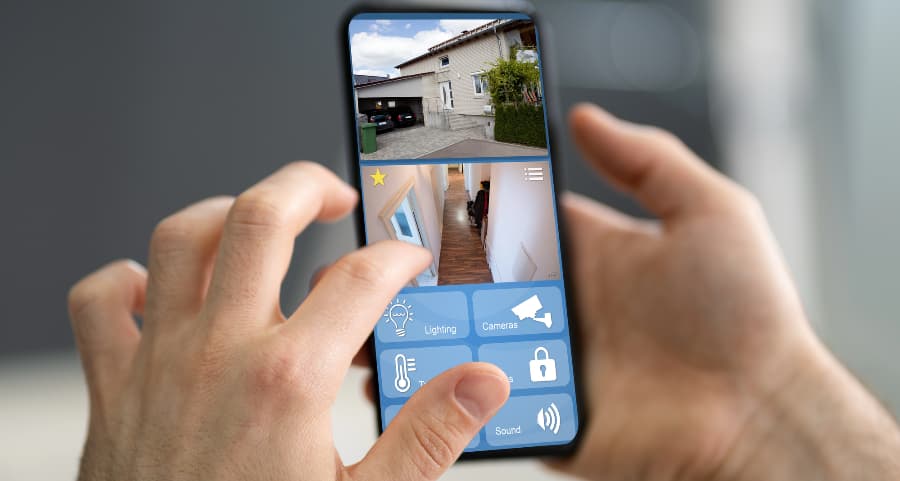 Resident examining surveillance camera feeds on a mobile device